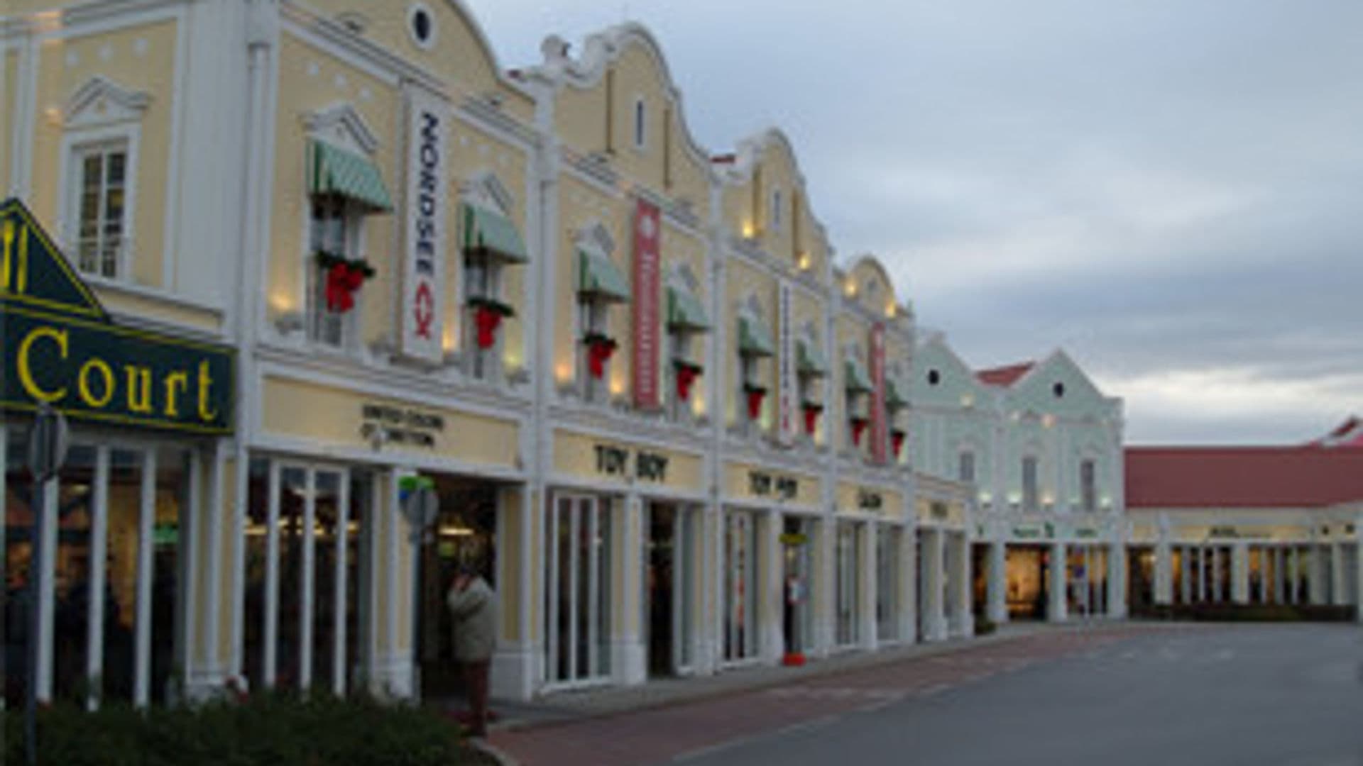 Facade of a shopping centre at dusk